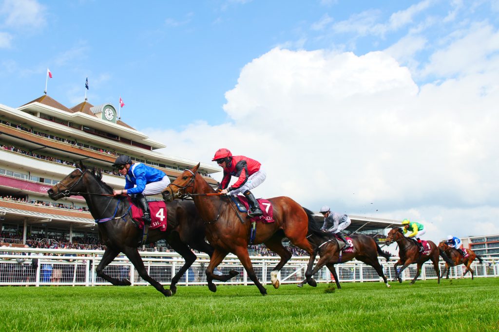 Khaadem winning from Oxted in the Newbury Carnarvon Stakes